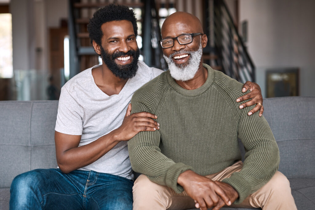 This is who I inherited the beard from Portrait of a happy young man relaxing and spending time with his father at home